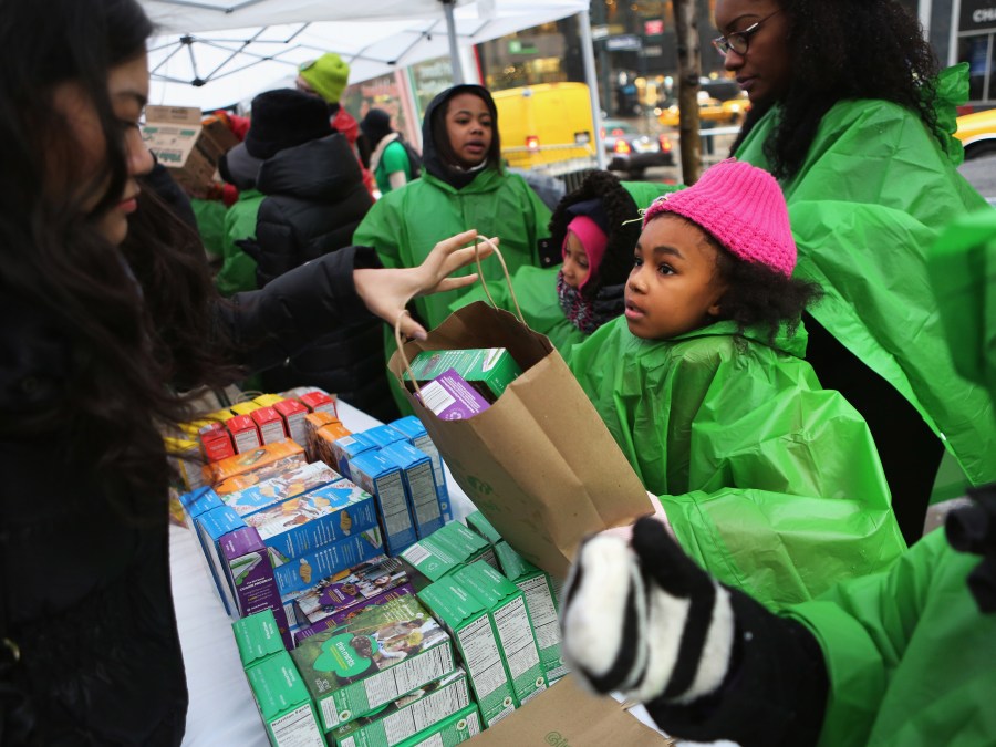Girl Scouts sell cookies as a winter storm moves in on February 8, 2013 in New York City.