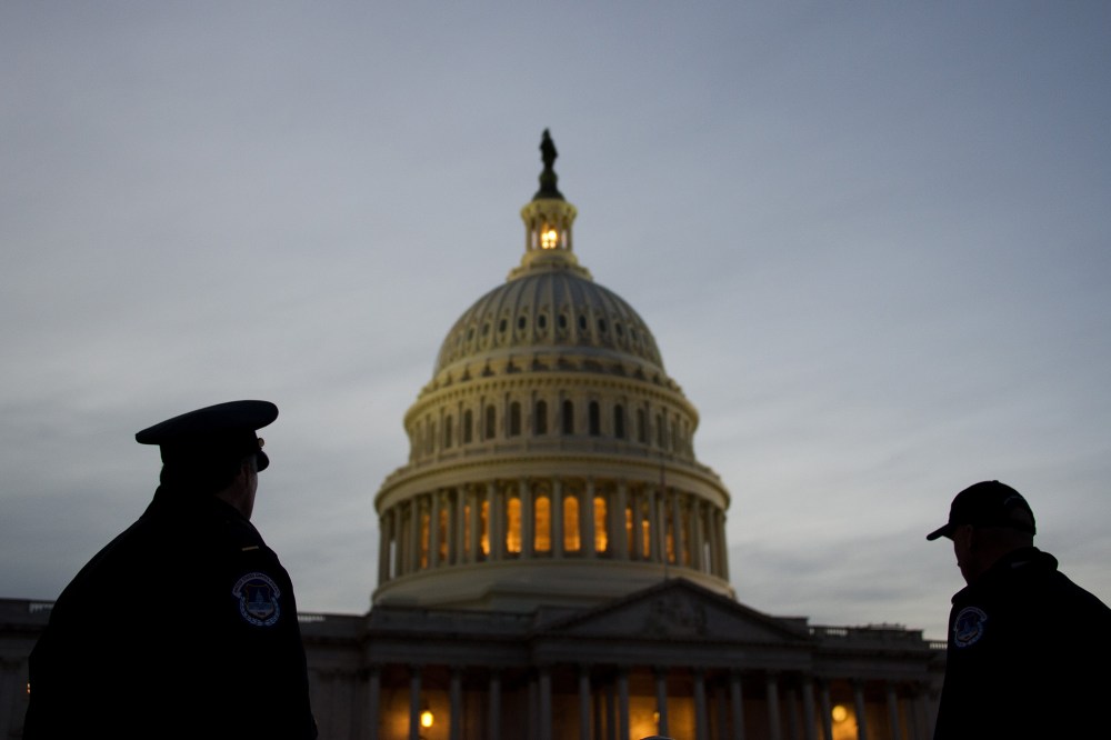 U.S. Capitol Police stand guard in front of the U.S. Capitol in Washington, D.C. (Photo by Jim Watson/AFP/Getty)