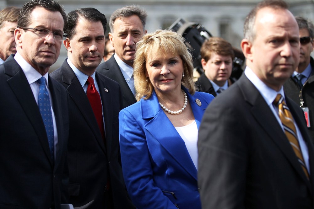 (L-R) Connecticut Governor Dan Malloy, Wisconsin Governor Scott Walker, Vermont Governor Peter Shumlin, and NGA Chairperson Mary Fallin, listen as they speak to members of the press in D.C., Feb. 25, 2013.