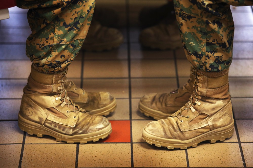 Marine recruits sit while having lunch during boot camp on February 26, 2013 at MCRD Parris Island, South Carolina.