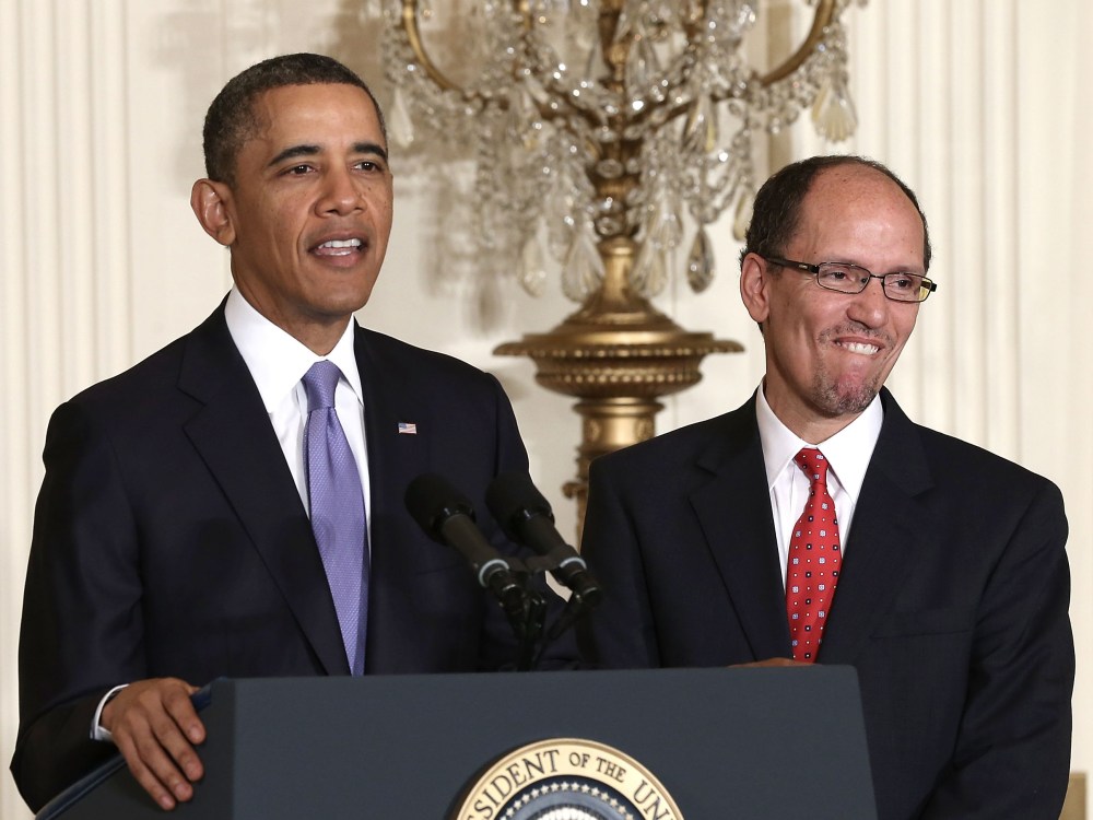 U.S. President Barack Obama (L) speaks as Assistant Attorney General of Justice Department's civil rights division Thomas Perez (R) listens during a personnel announcement March 18, 2013 at the East Room of the White House in Washington, DC. President...