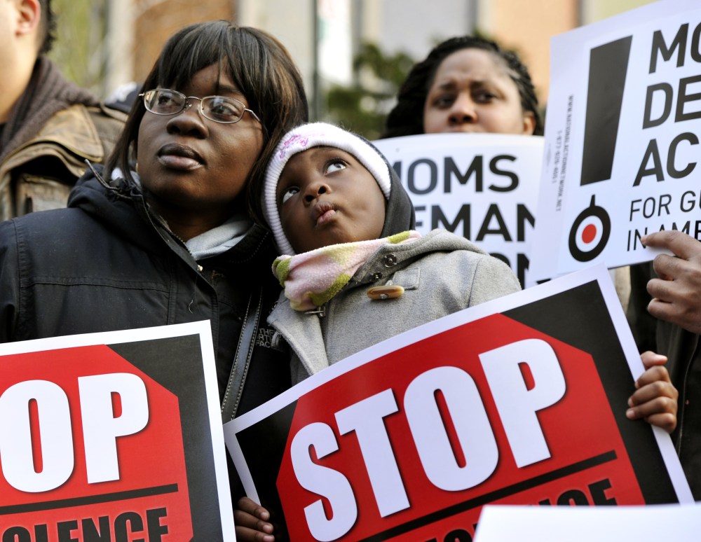 Demonstrators attend a rally and march to support federal and state gun control proposals on March 21, 2013 in the Harlem district of New York City.