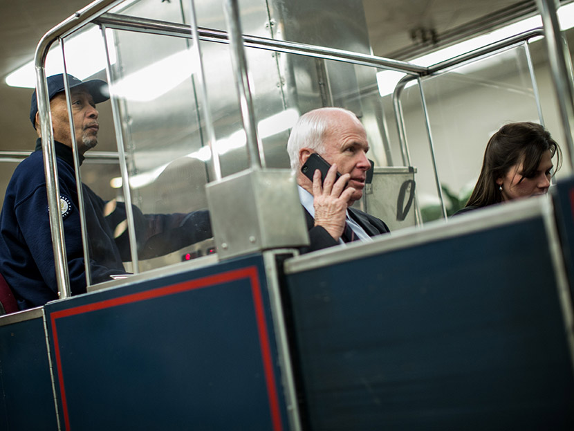 U.S. Sen. John McCain (R-AZ) (C) rides the Senate subway prior to votes on Capitol Hill March 22, 2013 in Washington, DC.  (Photo by Drew Angerer/Getty Images)