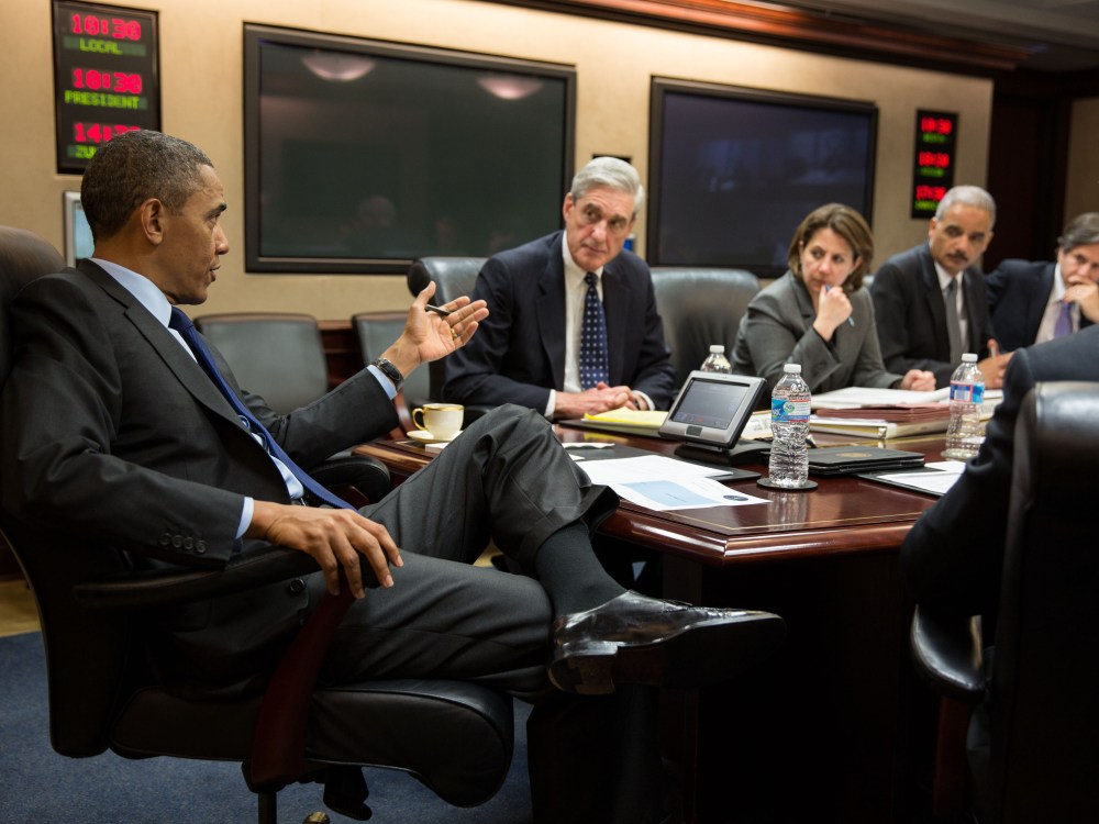In this handout provided by the White House, U.S. President Barack Obama (L) meets with members of his national security team to discuss developments in the Boston bombings investigation, in the Situation Room of the White House on April 19, 2013 in...