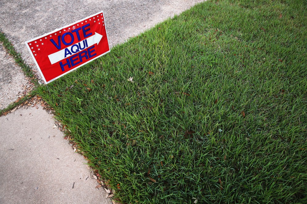 English-Spanish Signs Front Election Center In Texas