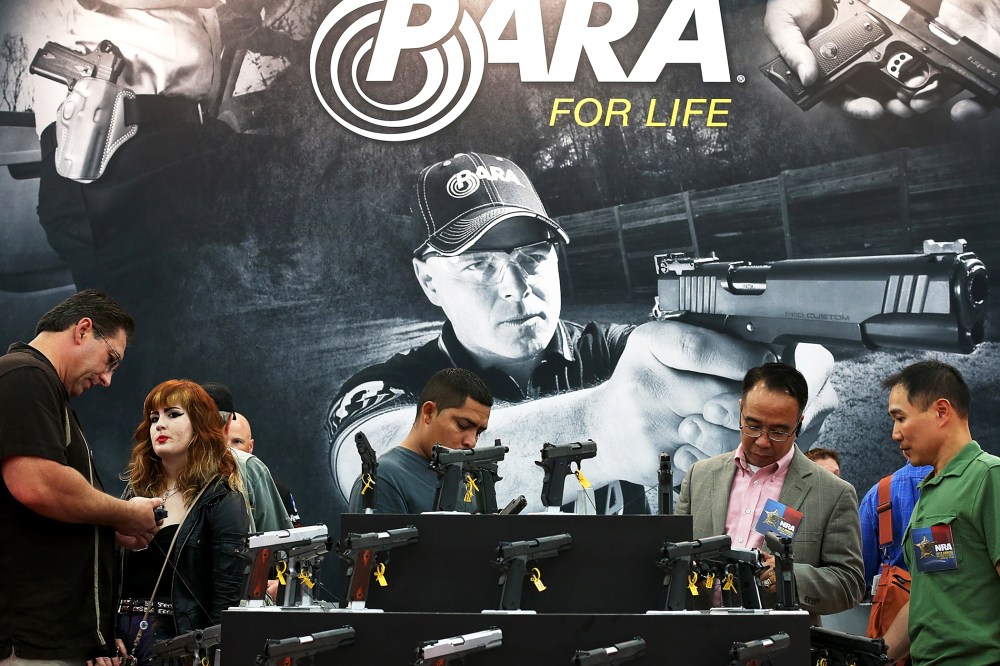 Attendees visit the Para booth at the 2013 NRA Annual Meeting and Exhibits in Houston, Texas, May 5, 2013.