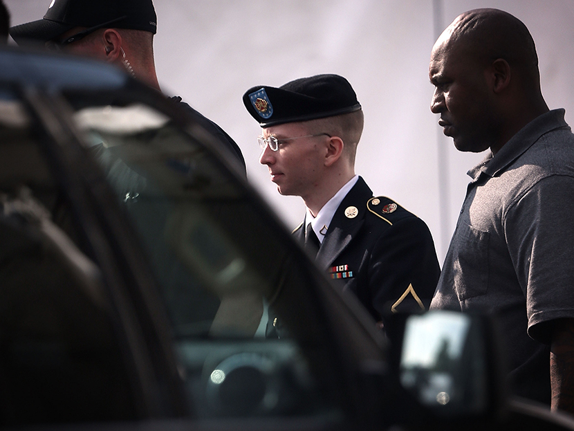 U.S. Army Private First Class Bradley Manning (C) is escorted as he leaves a military court for the day June 3, 2013 at Fort Meade in Maryland.  (Photo by Alex Wong/Getty Images)
