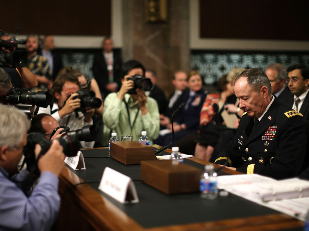 File photo: Army Gen. Keith Alexander, director of the National Security Agency (NSA) is surrounded by photographers after arriving at a Senate Appropriations Committee hearing June 12, 2013. (Photo by Mark Wilson/Getty Images)