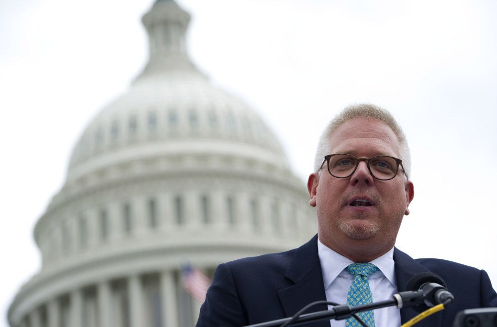 Conservative radio and television commentator Glenn Beck speaks to a rally of Tea Party members as they protest against the Internal Revenue Service (IRS) targeting of the Tea Party and similar groups, June 19, 2013. (Photo by Saul Loeb/AFP/Getty)
