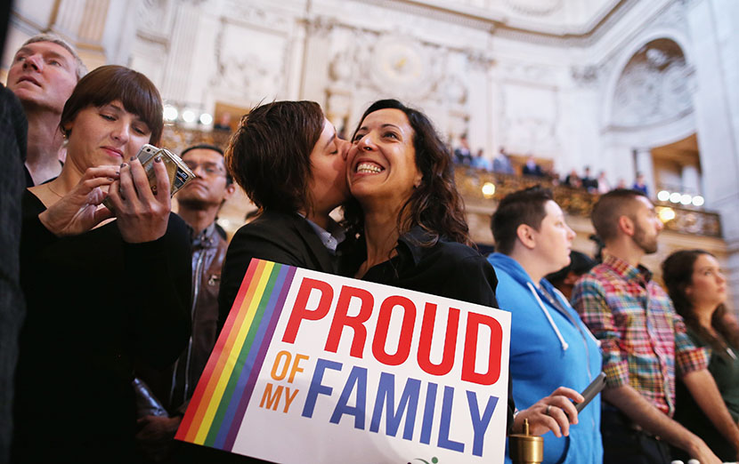 A couple celebrates upon hearing the U.S. Supreme Court's rulings on gay marriage in San Francisco on June 26, 2013. (Photo by Justin Sullivan/Getty Images)