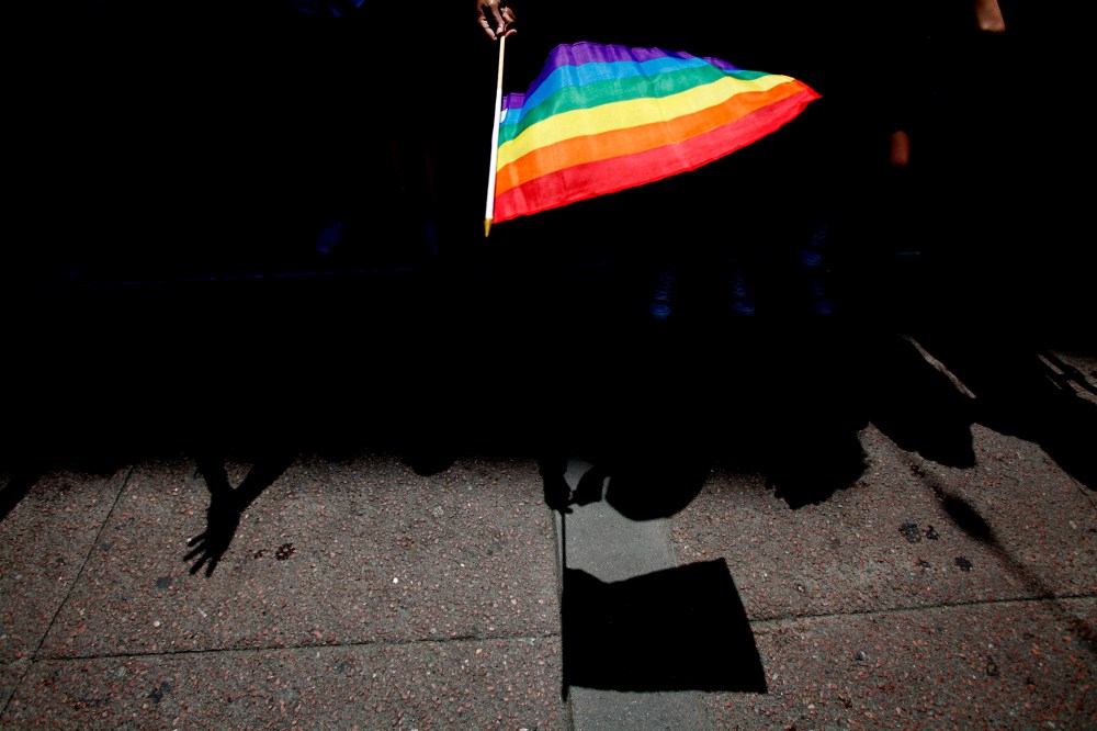 A parade goer waves a flag during 43rd annual San Francisco Lesbian, Gay, Bisexual, Transgender (LGBT) Pride Celebration & Parade June 30, 2013, in San Francisco, Calif. (Photo by Sarah Rice/Getty)