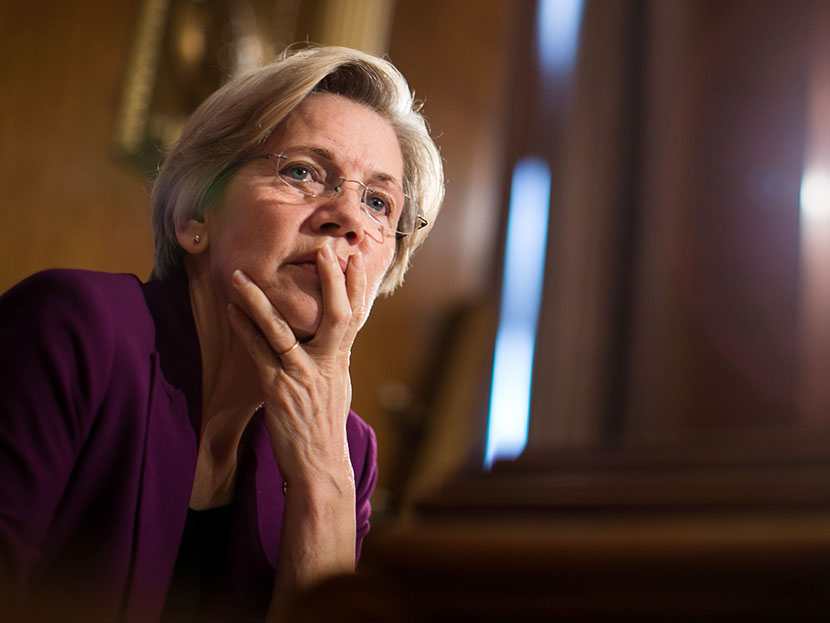 U.S. Sen. Elizabeth Warren (D-MA) listens to testimony from witnesses during a Senate Banking, Housing and Urban Affairs Committee hearing on "Mitigating Systemic Risk Through Wall Street Reforms," on Capitol Hill, July 11, 2013 in Washington, DC. ...