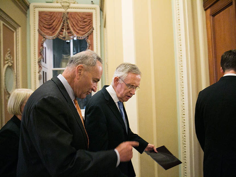 Sen. Chuck  Schumer (D-NY) and Senate Majority Leader Harry Reid (D-NV) walk to Reid's office after Senate joint caucus meeting, on July 15, 2013 in Washington, DC.  (Photo by Drew Angerer/Getty Images)