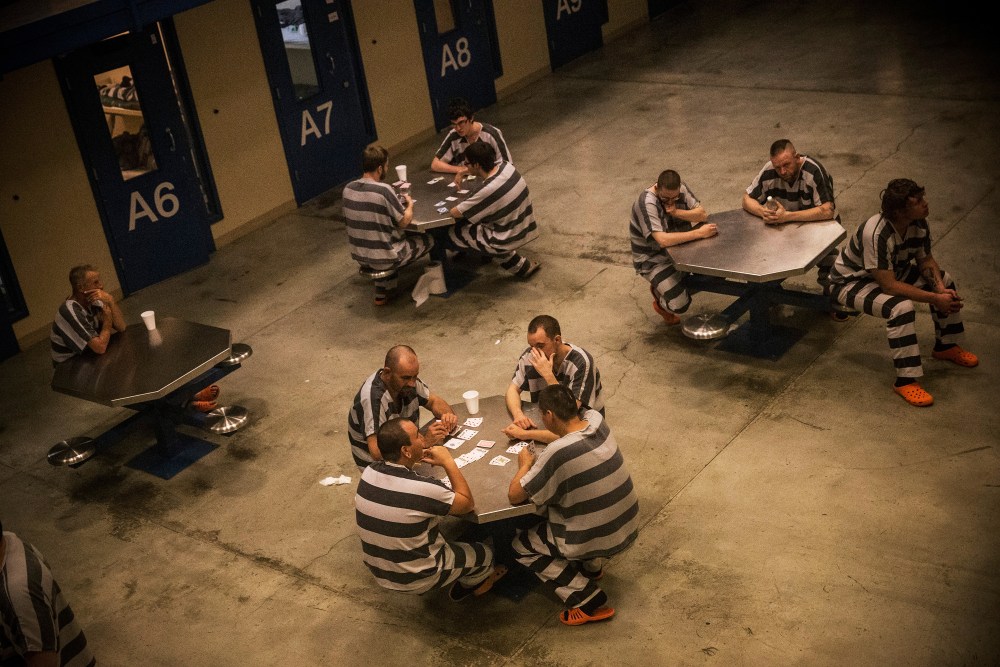Inmates sit in the county jail in Williston, ND, July 26, 2013.