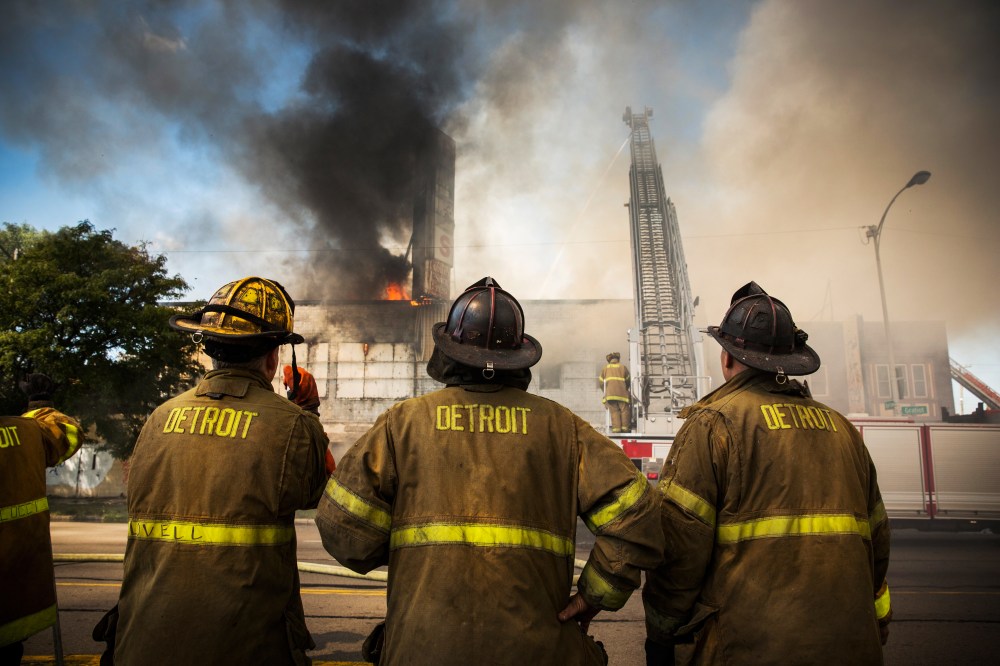 Members of the Detroit Fire Department fight a two-alarm fire that broke out in an abandoned building on September 4, 2013.