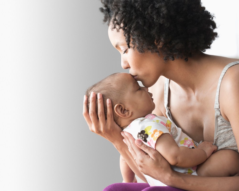 Image: Mother playing with baby indoors