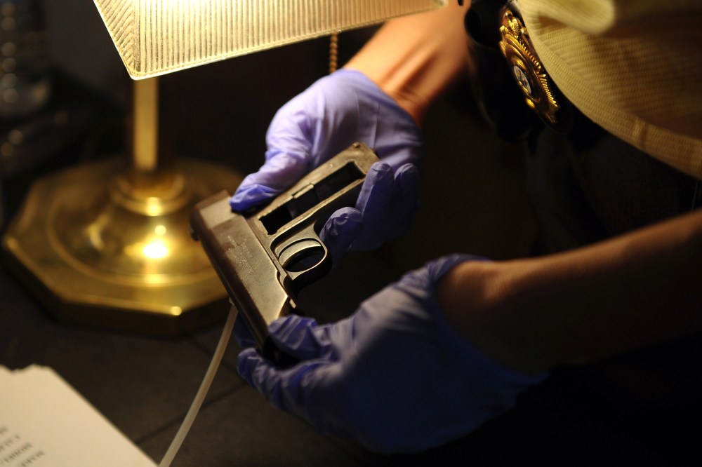 A handgun is checked during a state and county sponsored gun buyback, Sept. 27, 2013 in Old Bridge, N.J.