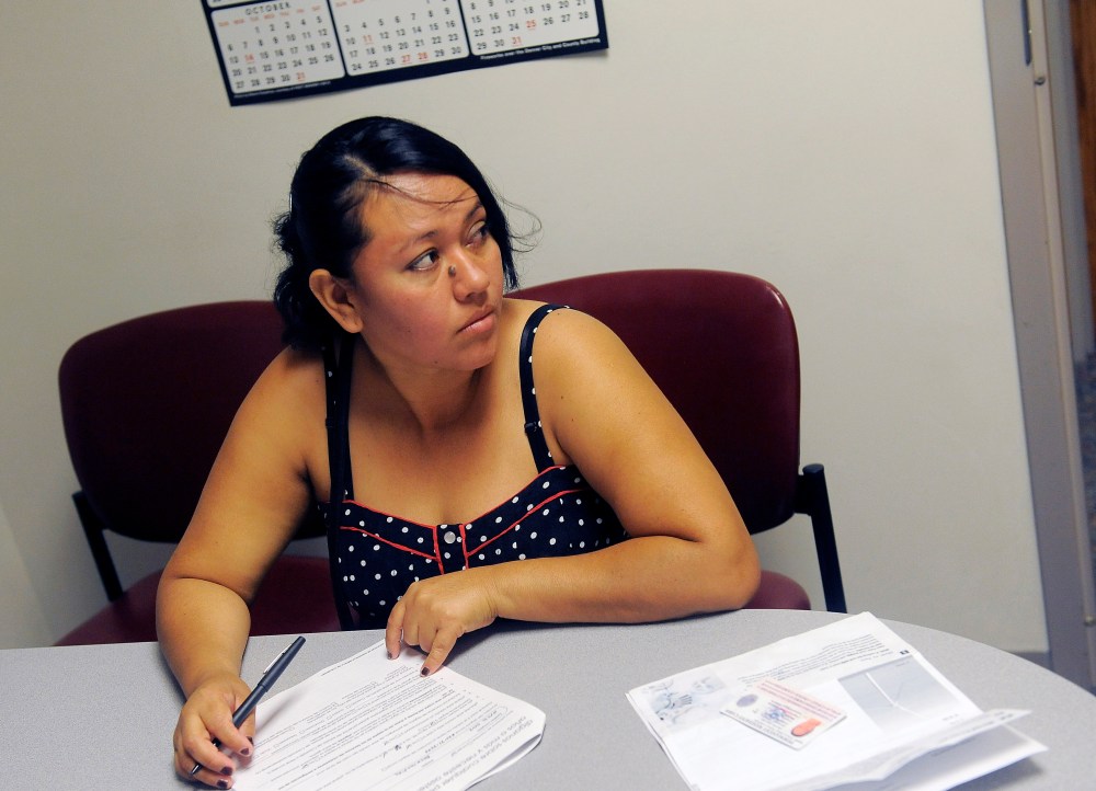 Rosa Ayala Cruz applies for health benefits at the Denver Health Westside Family Health Center on October 01, 2013 in Denver, Colorado.