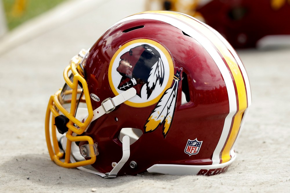 Washington Redskins helmets lay on the ground during their game against the Oakland Raiders at on September 29, 2013 in Oakland, Calif.