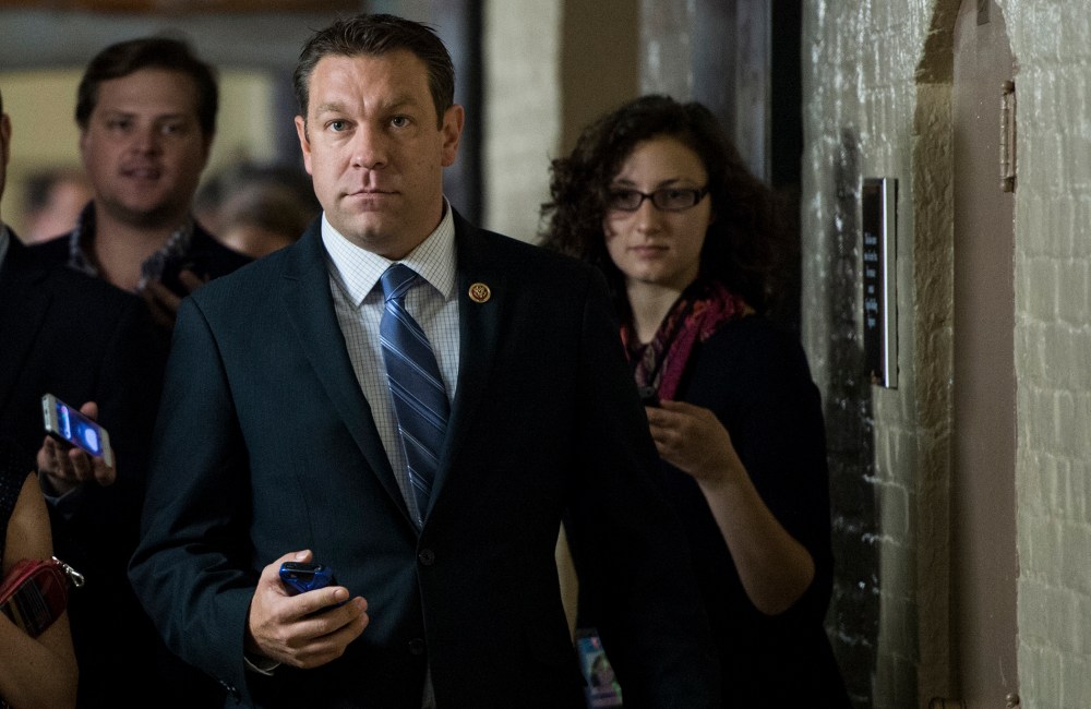 Rep. Trey Radel, R-Fla., speaks with reporters as he leaves the House Republican Conference meeting in the basement of the Capitol on Friday, Oct. 4, 2013.