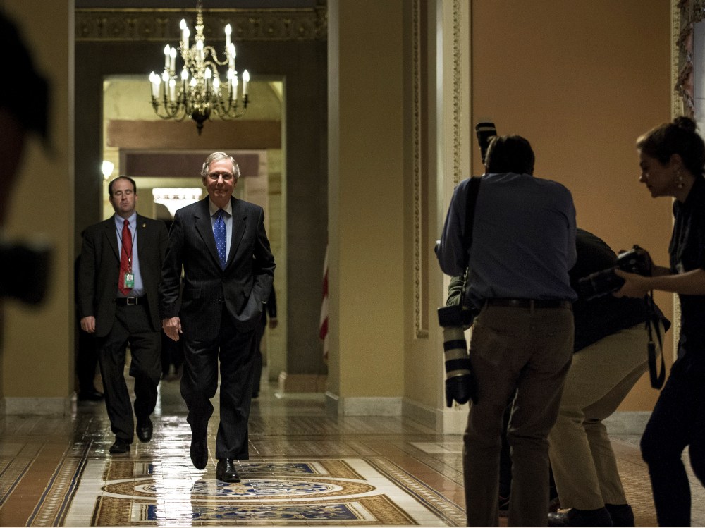 Senate Minority Leader Senator Mitch McConnell walks to a vote on Capitol Hill October 16, 2013 in Washington, DC.