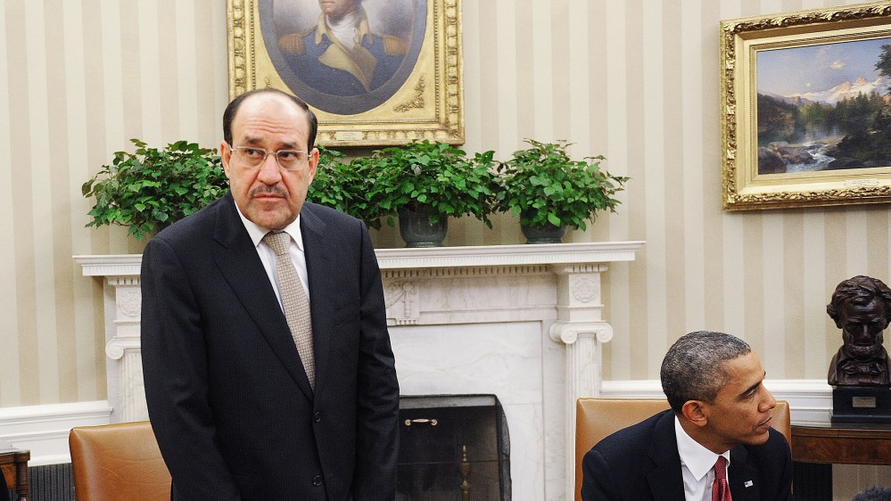 Iraqi Prime Minister Nouri Al-Maliki (L) looks on after a meeting U.S. President Barack Obama in the Oval Office at the White House November 1, 2013 in Washington, DC.