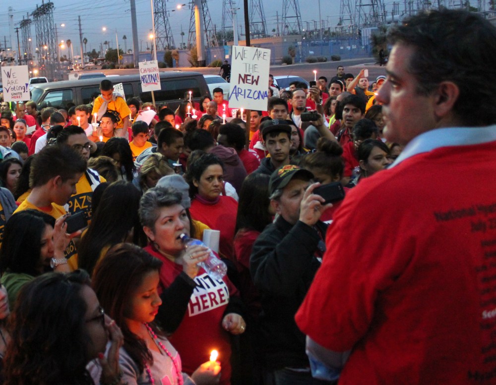Supporters of the Adios Arpaio campaign hold a candlelight vigil outside the Maricopa County Recorder's office in Phoenix, Ariz. on November 15, 2012. (Photo courtesy of UNITE HERE.)