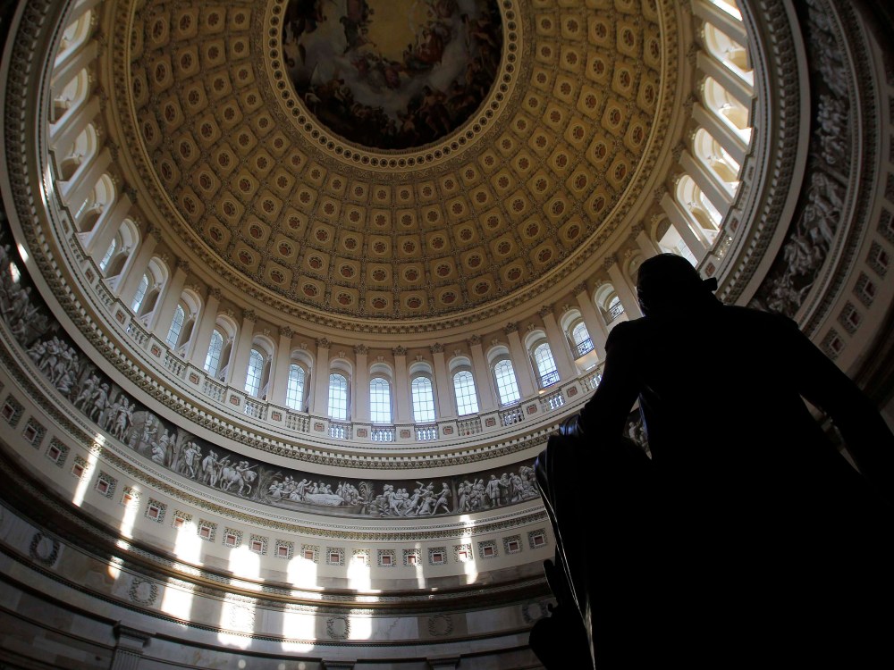 Image: A statue of the United States first President, George Washington, is seen under the Capitol dome in Washington