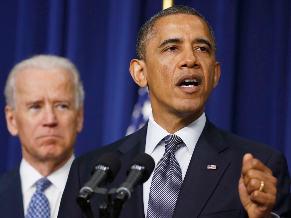 President Barack Obama unveils a series of proposals to counter gun violence as Vice President Joe Biden looks on during an event at the White House in Washington on January 16, 2013. (Photo by Larry Downing/Reuters)