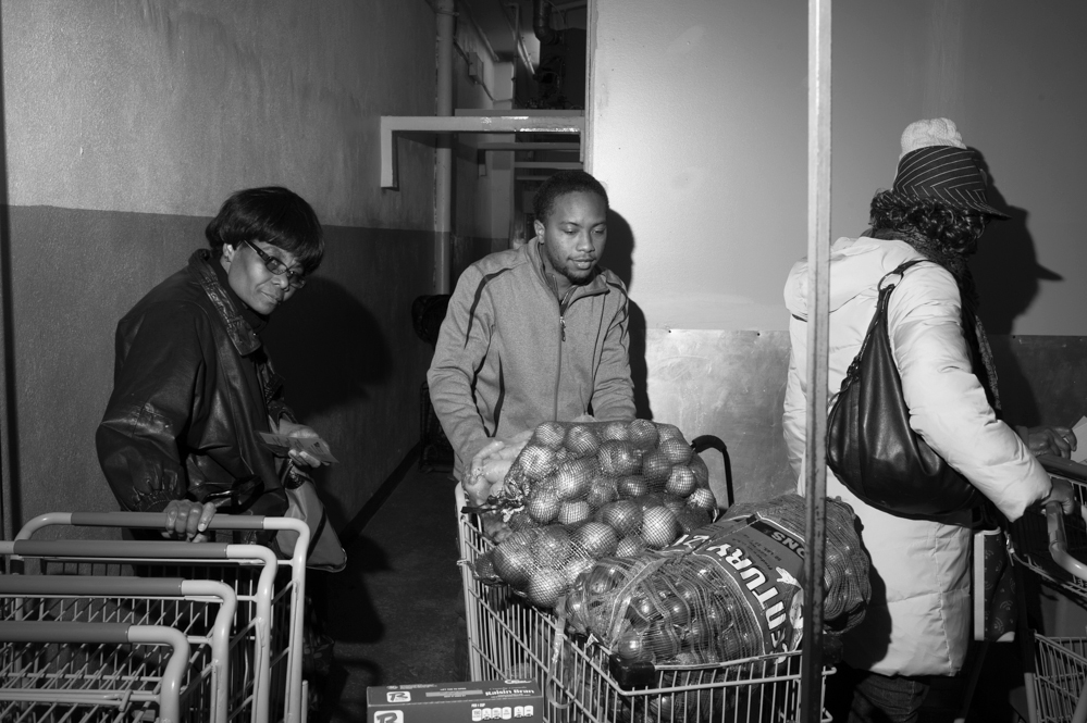 Paul Jones brings bags of onions to restock bins at the Bed-Stuy Campaign Against Hunger food pantry, in Brooklyn, New York.