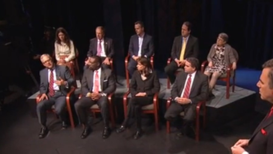 This image, captured from the video of a New Jersey Public Television program, which aired May 16, 2013, shows Hoboken, N.J. Mayor Dawn Zimmer seated in the front row between Belmar, N.J. Mayor Matt Doherty, right, and DCA Commissioner Richard Constable,