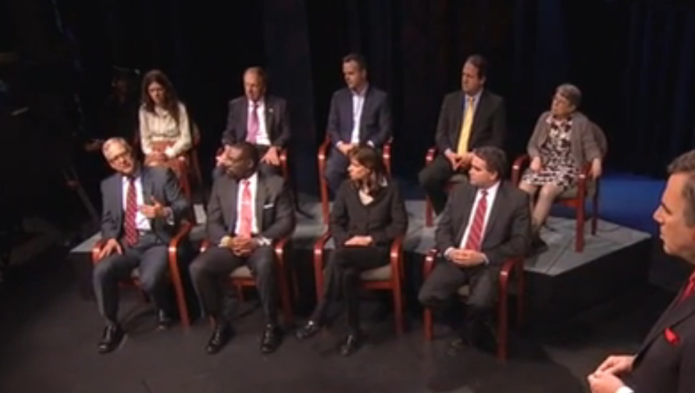 This image, captured from the video of a New Jersey Public Television program, which aired May 16, 2013, shows Hoboken, N.J. Mayor Dawn Zimmer seated in the front row between Belmar, N.J. Mayor Matt Doherty, right, and DCA Commissioner Richard Constable,