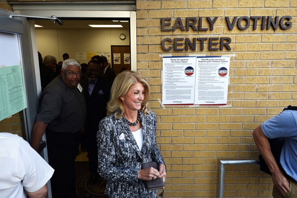 Wendy Davis exits the Early Voting Center after casting her vote on the first day of voting at the Charles Griffin Sub-Courthouse in Fort Worth, Texas on Oct. 20, 2014.