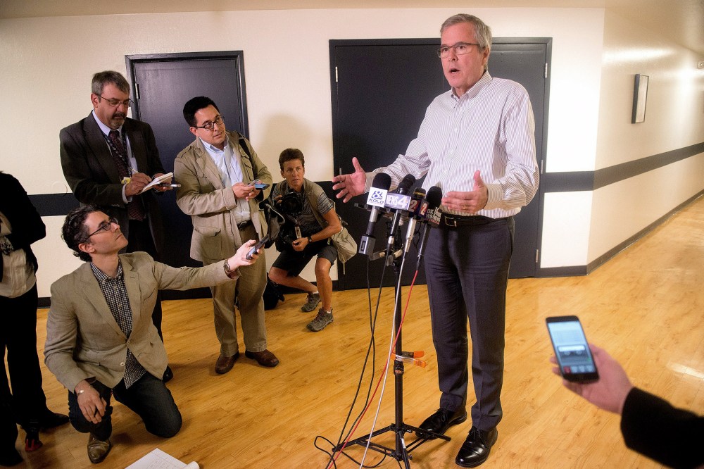 Former Florida Governor Jeb Bush talks with the media after speaking at a town hall meeting in Reno, Nevada on May 13, 2015.