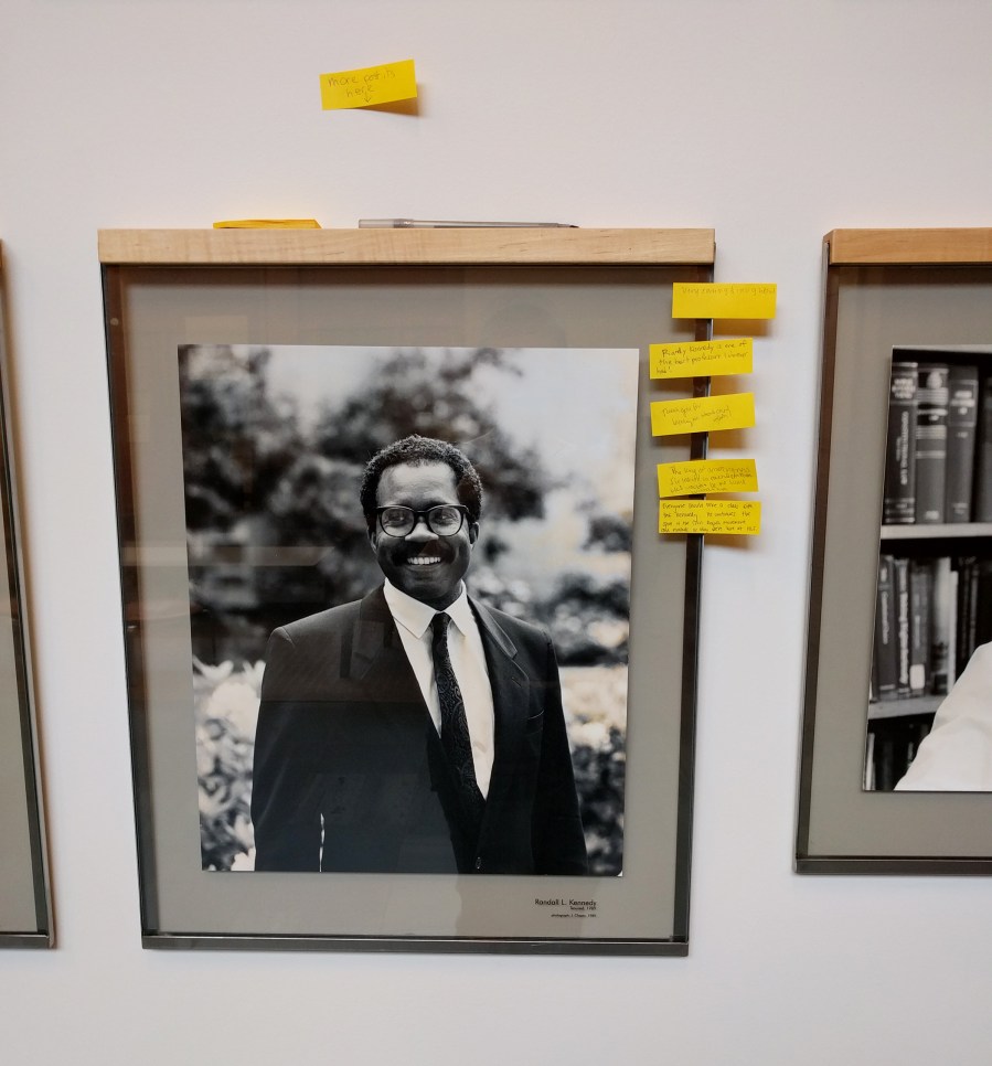 After black tape defacing Harvard Law School faculty members was removed, students added post-it notes with positive statements, seen here, such as 