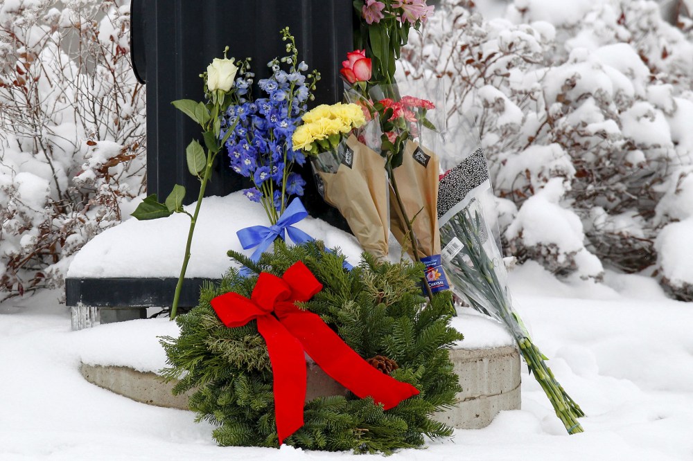 Flowers are left at an intersection near the Planned Parenthood clinic in Colorado Springs, Colo., Nov. 28, 2015. (Photo by Isaiah J. Downing/Reuters)