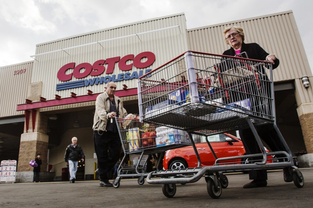 Shoppers leave a Costco store in Alhambra, Calif. on March 3, 2015. (Photo by Ringo Chiu/ZUMA)