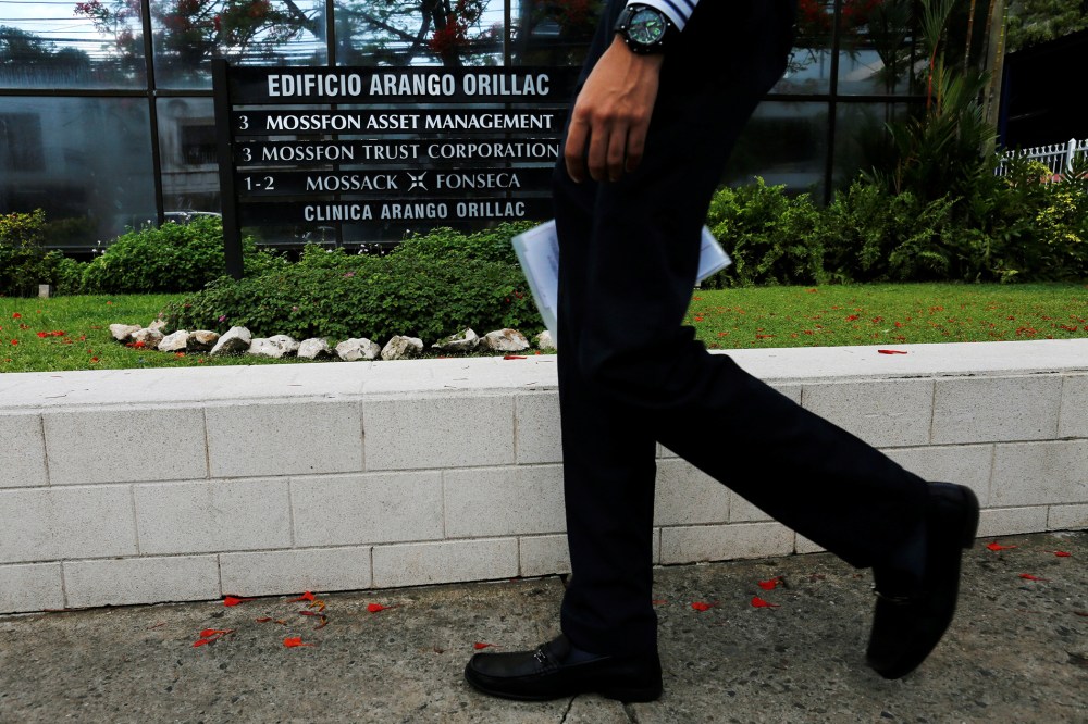 A man walks past a company list showing the Mossack Fonseca law firm at the Arango Orillac Building in Panama City May 9, 2016. (Photo by Carlos Jasso/Reuters)