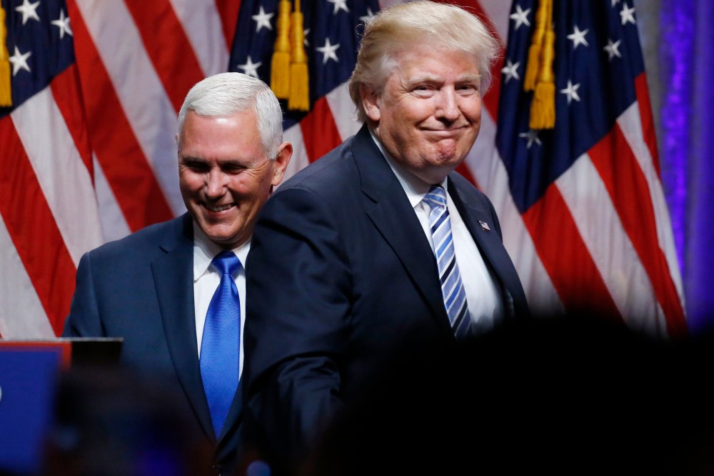 Republican U.S. presidential candidate Donald Trump steps away after greeting Indiana Governor Mike Pence during the introduction of Pence as his vice presidential running mate in New York City, July 16, 2016. (Photo by Carlo Allegri/Reuters)