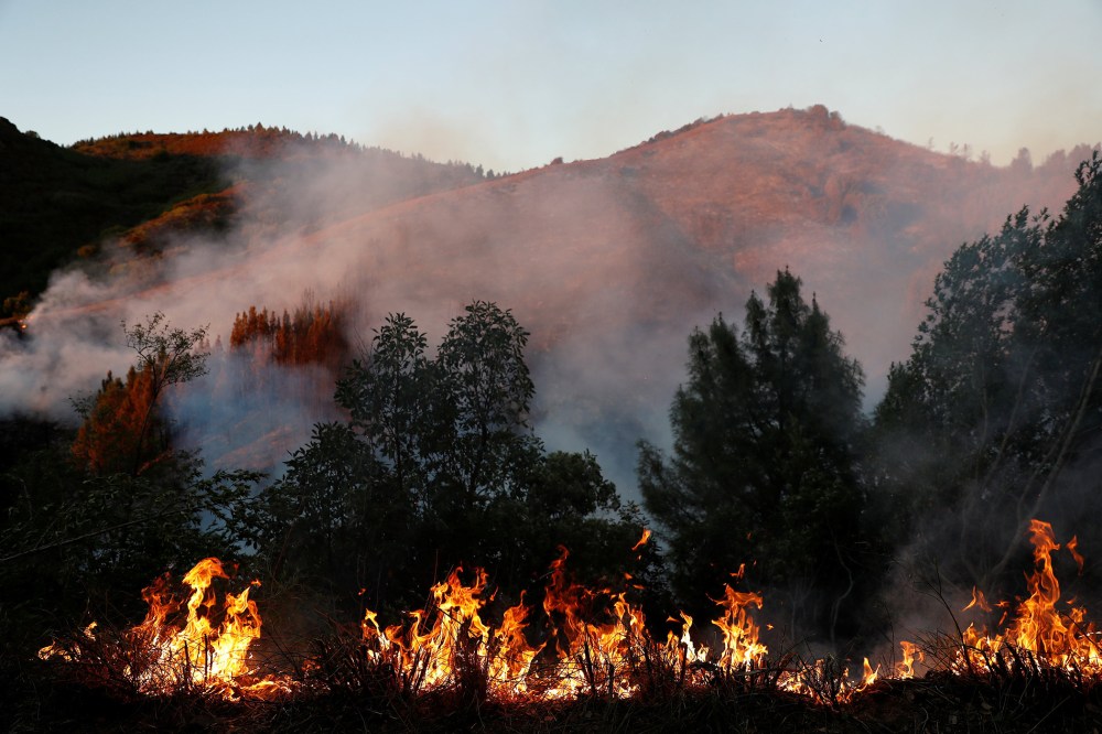 Smoke and flames are seen along Loma Prieta Avenue during the Loma Fire near Santa Cruz, Calif. on Sept. 27, 2016. (Photo by Stephen Lam/Reuters)