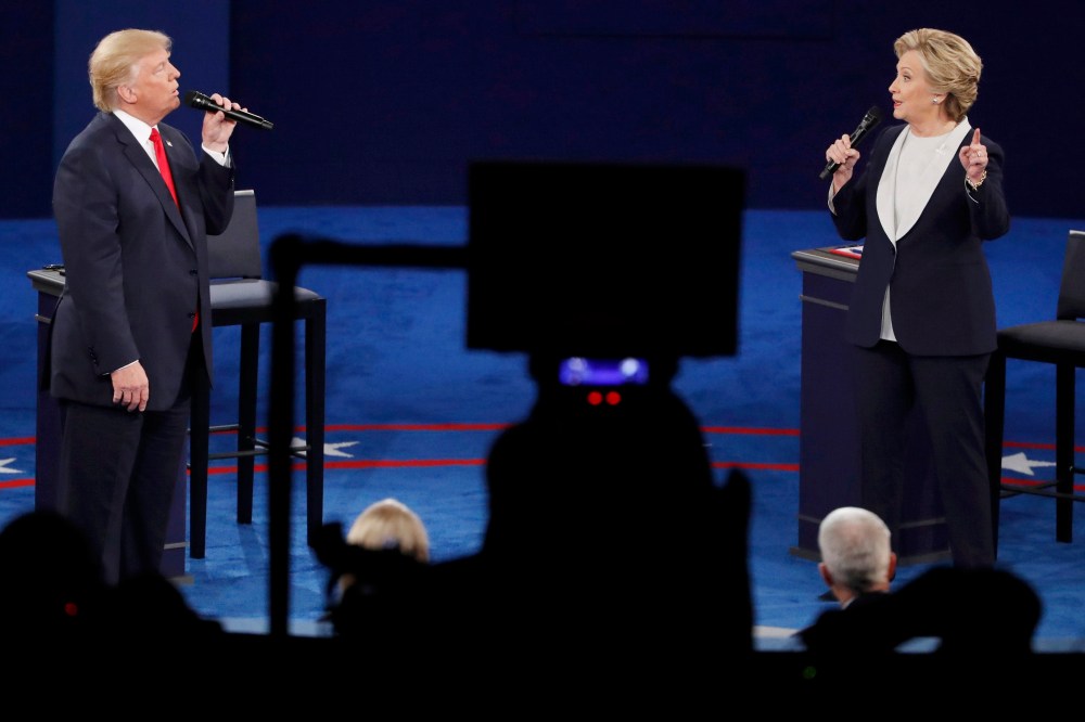 Republican presidential nominee Donald Trump and Democratic presidential nominee Hillary Clinton speak during their presidential town hall debate at Washington University, Oct. 9, 2016, in St. Louis, Mo. (Photo by Aaron P. Bernstein/Reuters)