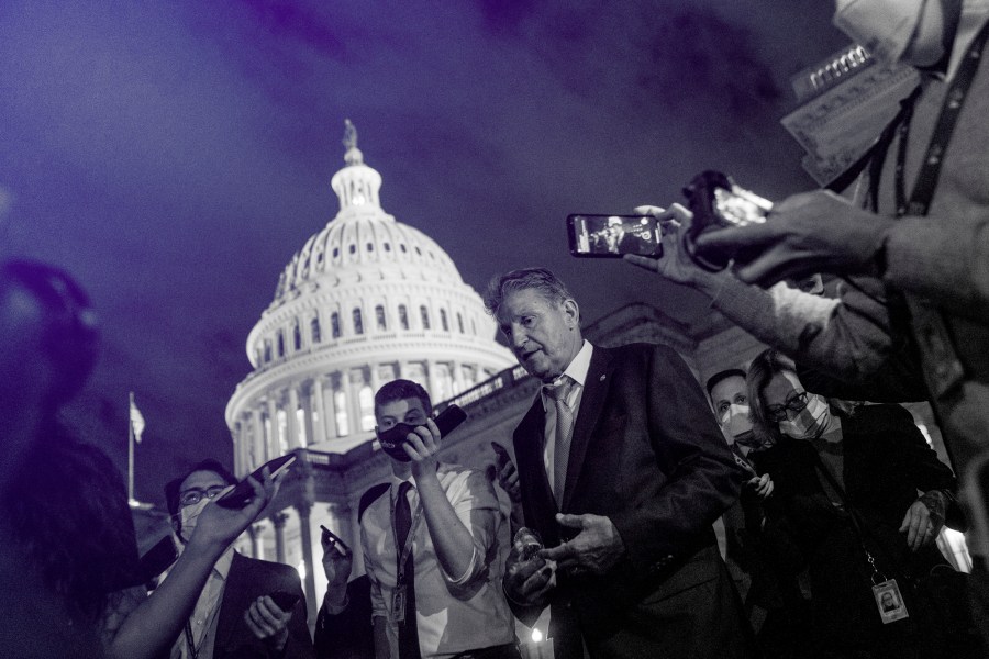 Image: Sen. Joe Manchin, D-W.Va., speaks to reporters after meeting with Sen. Kyrsten Sinema, D-Ariz., and other White House officials about the economic agenda at the Capitol on Sept. 30, 2021.