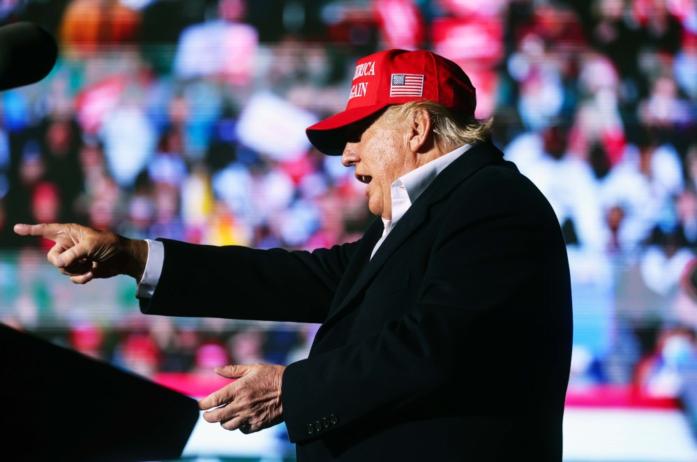Former President Donald Trump points to the crowd at a rally at the Canyon Moon Ranch festival grounds on January 15 in Florence, AZ.