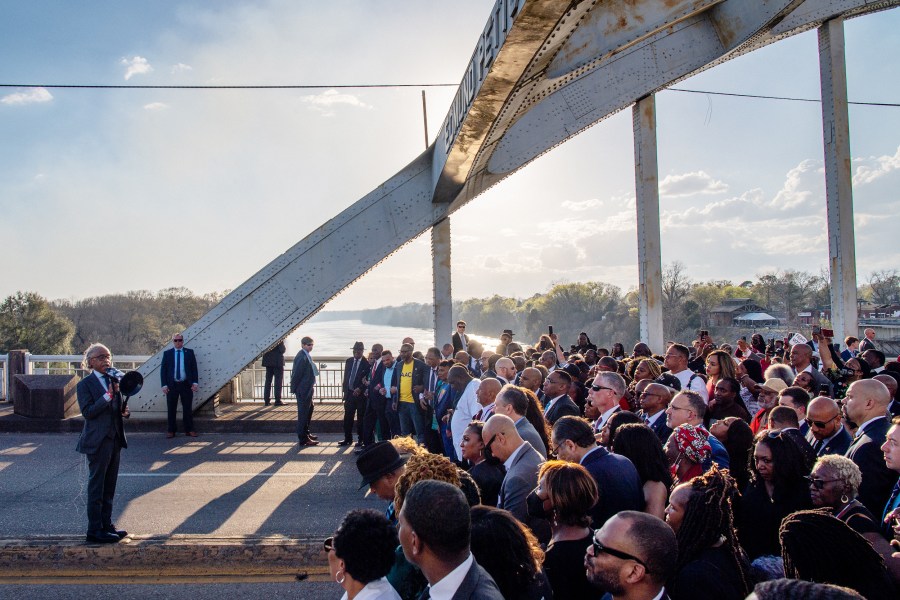 The Rev. Al Sharpton prepares marchers for a prayer on the Edmund Pettus Bridge during commemorations for the 57th anniversary of 