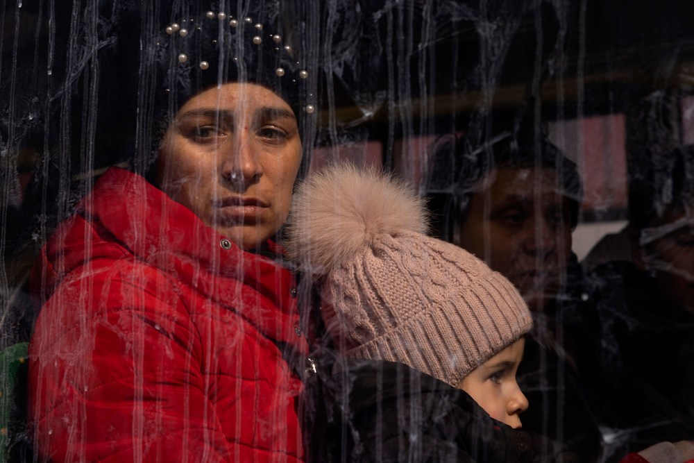 Image: Families board buses to Poland in Lviv, Ukraine, on March 12, 2022.