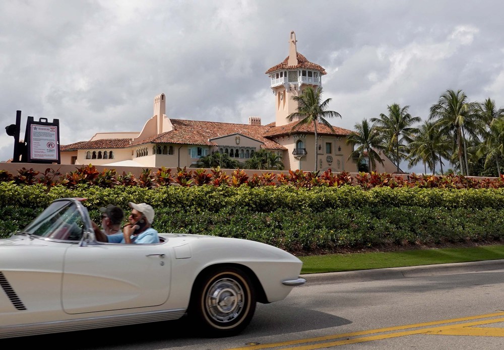 A car passes in front of former President Donald Trump's Mar-a-Lago resort on February 11, 2022 in Palm Beach, Fla.