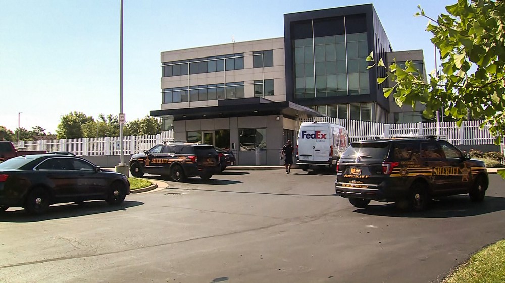 An armed man flashing an AR-15 style rifle fired a nail gun into an FBI Cincinnati building Thursday morning leading to a police pursuit and shots fired on an interstate, authorities said.