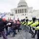 Insurrectionists loyal to President Donald Trump try to break through a police barrier, Wednesday, Jan. 6, 2021, at the Capitol in Washington. Facing prison time and dire personal consequences for storming the U.S. Capitol, some Jan. 6 defendants are trying to profit from their participation in the deadly riot, using it as a platform to drum up cash, promote business endeavors and boost social media profiles.