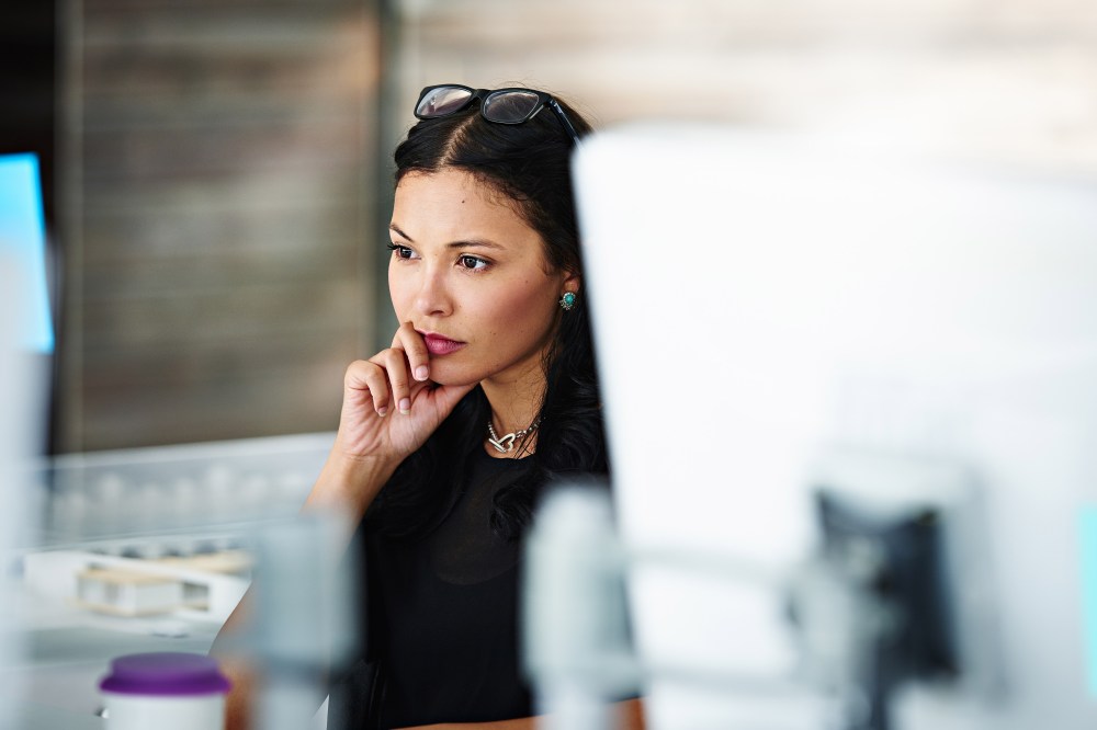 Architect at workstation contemplating the project