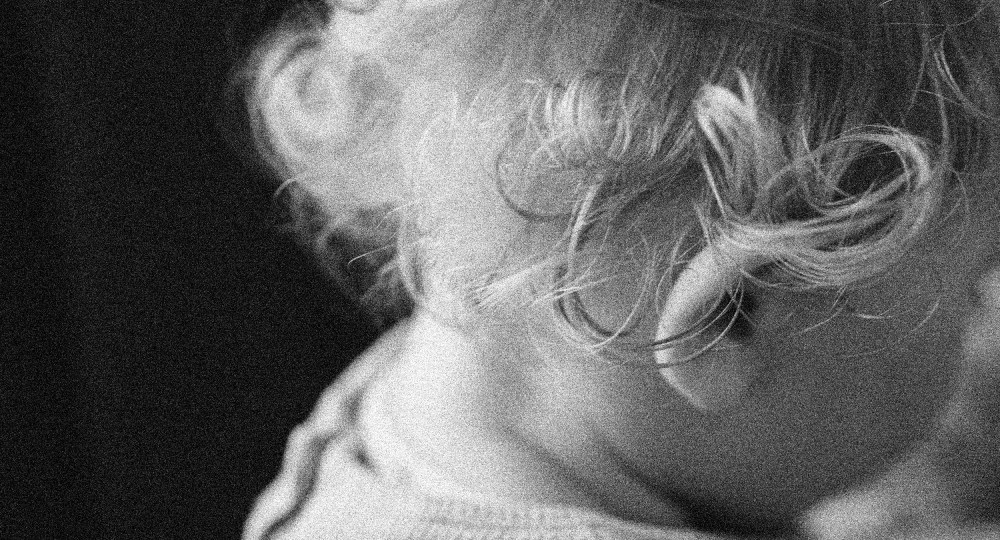 Image: A close up of a baby's head.